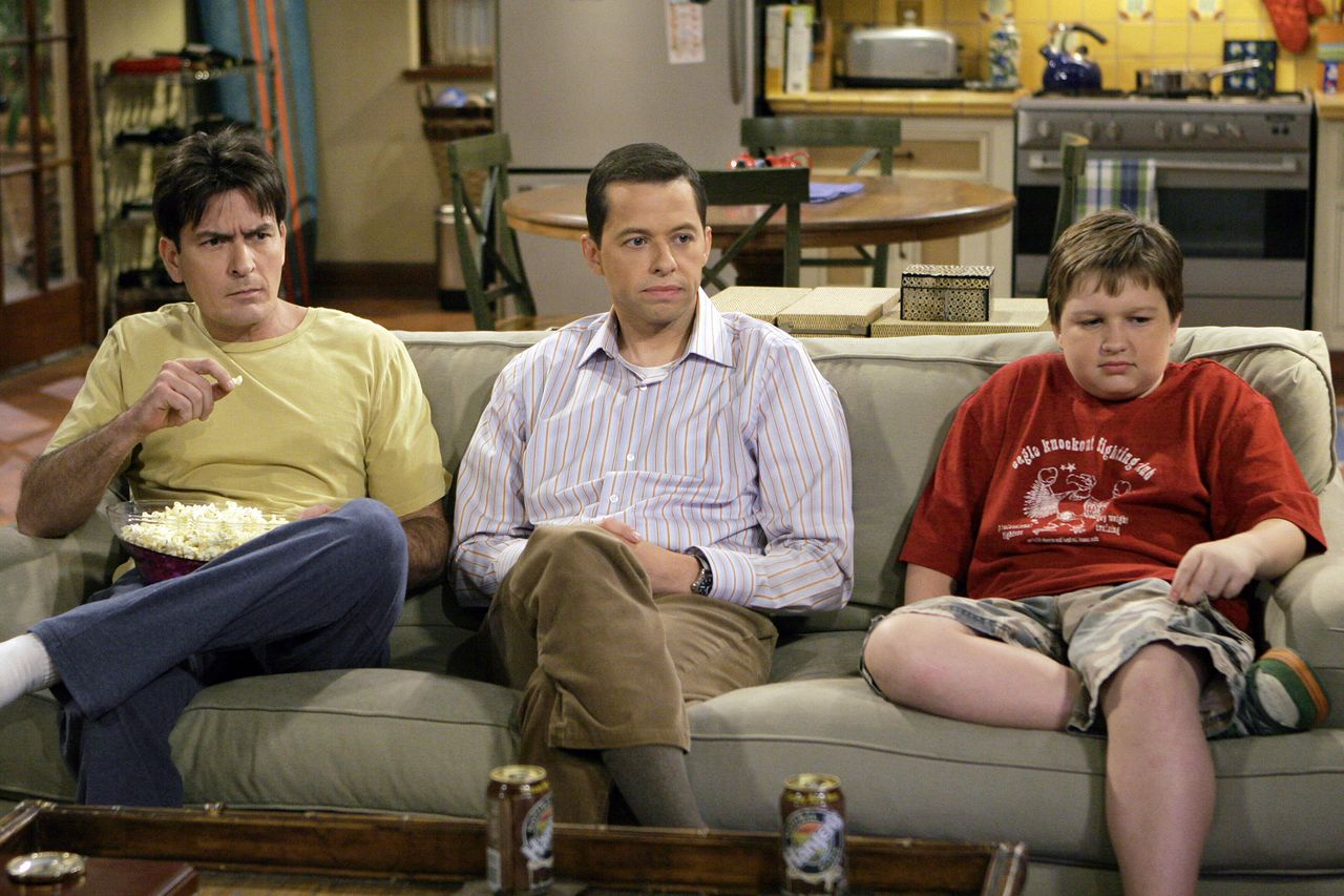 Charlie Sheen Jon Cryer and Angus T Jones sitting on a couch in a living room setting From left: Charlie Sheen, Jon Cryer and Angus T. Jones in 'Two and a Half Men'Credit: Shutterstock