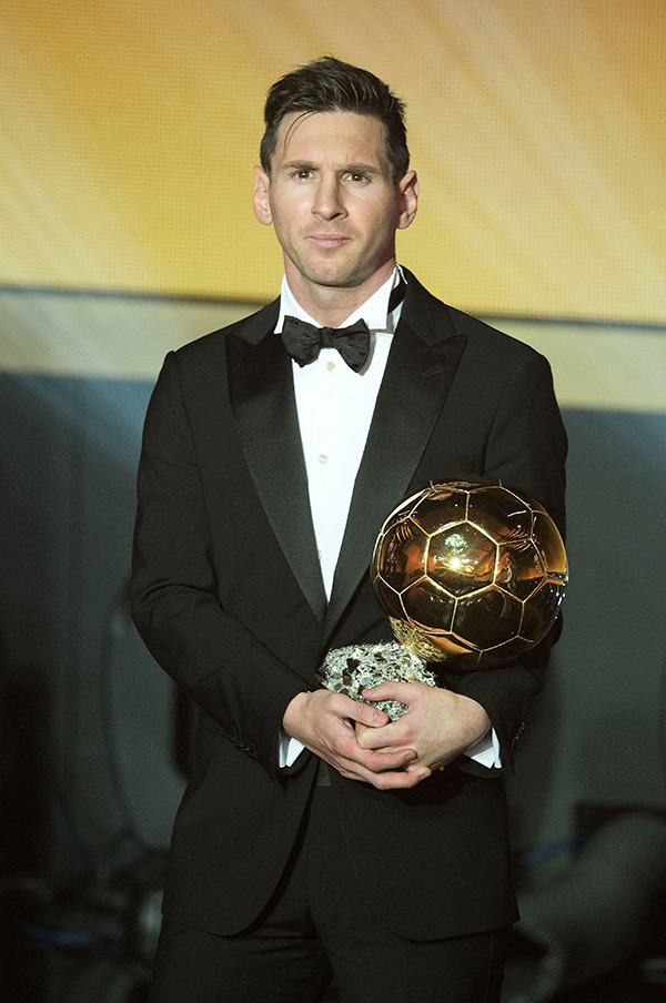 Lionel Messi with an award