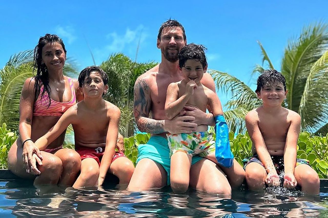 Antonella Roccuzzo and Lionel Messi sit poolside with their three sons in a photo shared on Instagram on July 11, 2023Credit: Instagram/leomessi
