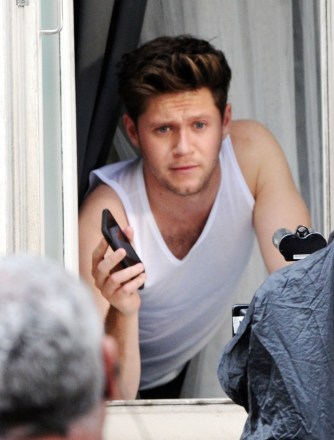 ** RIGHTS: ONLY UNITED STATES, BRAZIL, CANADA ** London, UNITED KINGDOM  - *EXCLUSIVE* Former One Direction turned solo artist Niall Horan and the sexy Australian glamour model Georgia Mae Gibbs are seen filming together in London.Niall and Georgia were on the set of Niall's much anticipated new single filming his new music video with machines filling the air with smoke creating a moody scene as a stylish Niall struts his stuff for the cameras wearing a suit and in one scene wearing his white vest top. *Shot on 09/16/19*Pictured: Niall HoranBACKGRID USA 17 SEPTEMBER 2019 BYLINE MUST READ: #OVOWAZZA / BACKGRIDUSA: +1 310 798 9111 / usasales@backgrid.comUK: +44 208 344 2007 / uksales@backgrid.com*UK Clients - Pictures Containing ChildrenPlease Pixelate Face Prior To Publication*