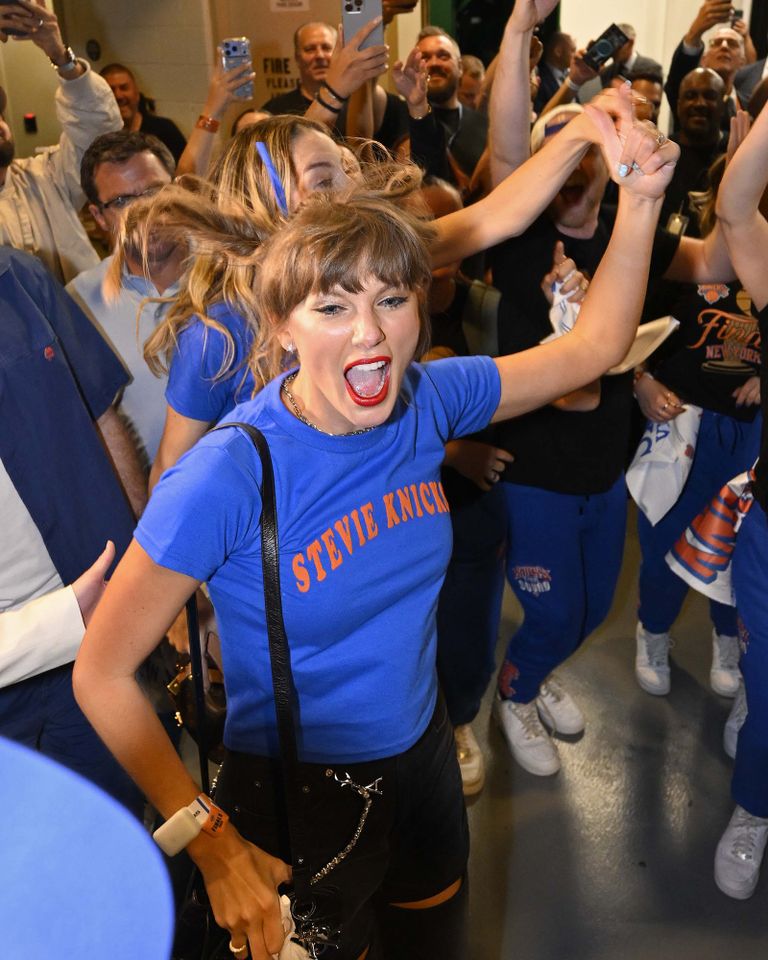 Taylor Swift celebrates the New York Knicks' win over the San Antonio Spurs in Game 4 of the NBA Finals on June 10.Credit: David Dow/NBAE via Getty
