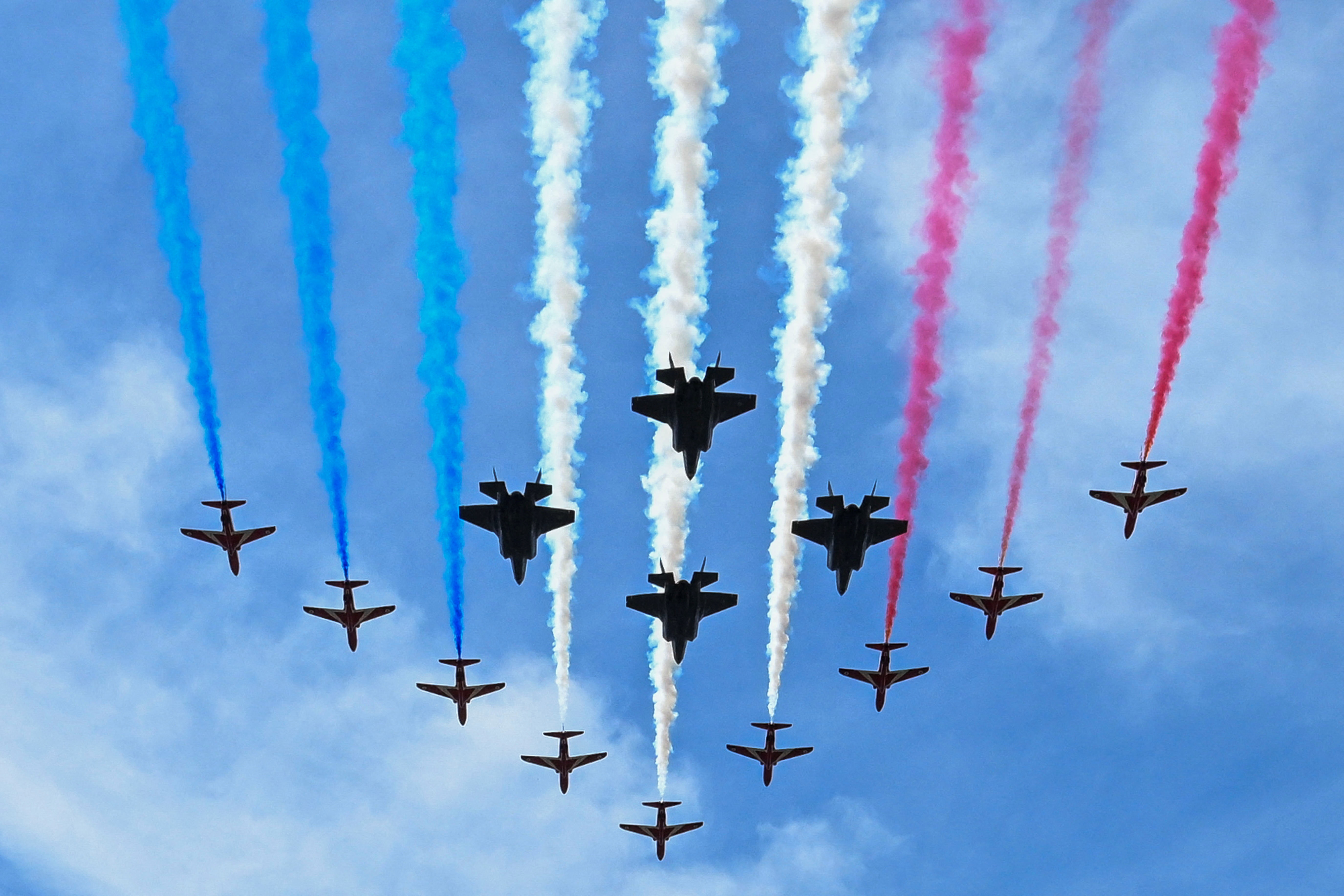 The Red Arrows perform a flypast over Buckingham Palace.
