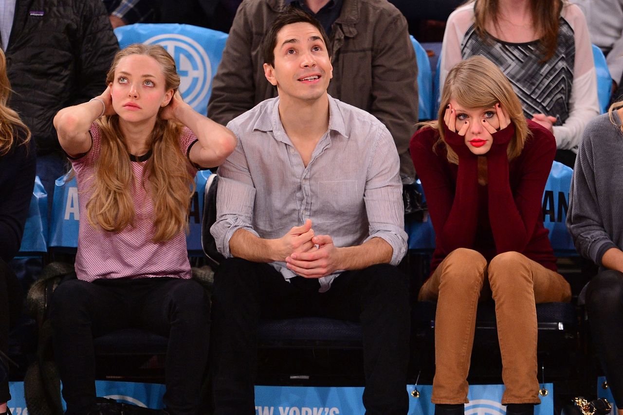 Amanda Seyfried, Justin Long and Taylor Swift attend the Orlando Magic vs New York Knicks game on November 12, 2014 in New York City.Credit: James Devaney/GC Images