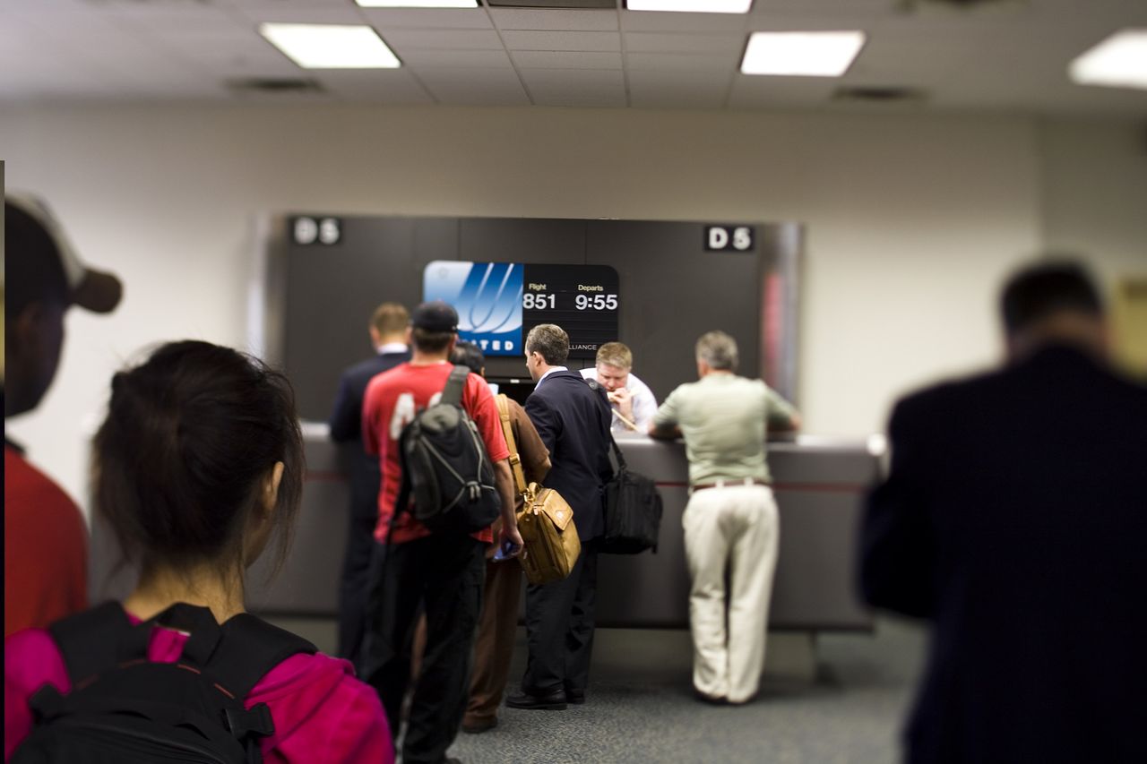 Passengers line up at a United Airlines gate.Credit: Jeff Hutchens/Getty