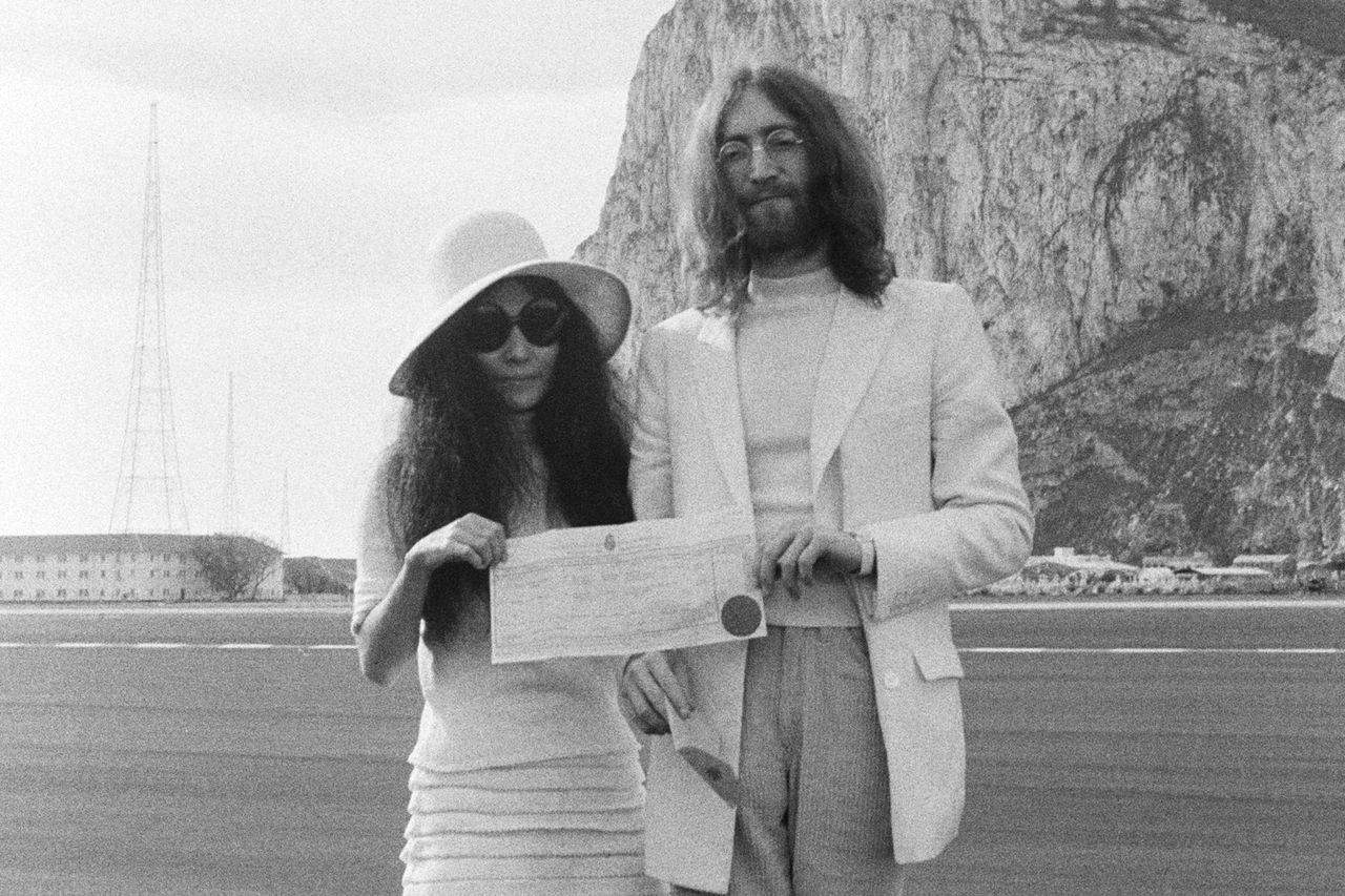John Lennon and Yoko Ono hold their marriage certificate on their wedding day on March 20th, 1969 in Gibraltar.Credit: Simpson/Daily Express/Hulton Archive/Getty