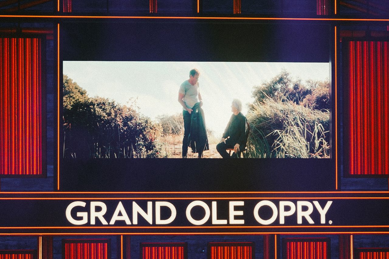 Dennis Quaid and Kris Kristofferson on-screen at the Grand Ole OpryCredit: Caleb Herring