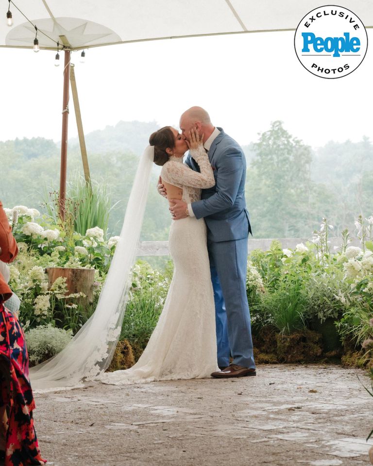 Jessica Vosk and David Godar kiss at their wedding ceremonyCredit: Laurel Hinton