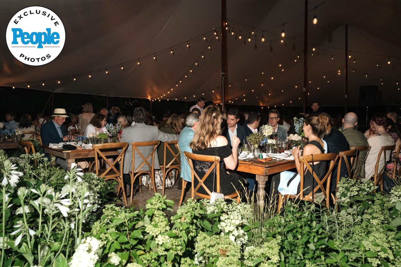 Guests dine at Jessica Vosk and David Godar’s wedding receptionCredit: Laurel Hinton