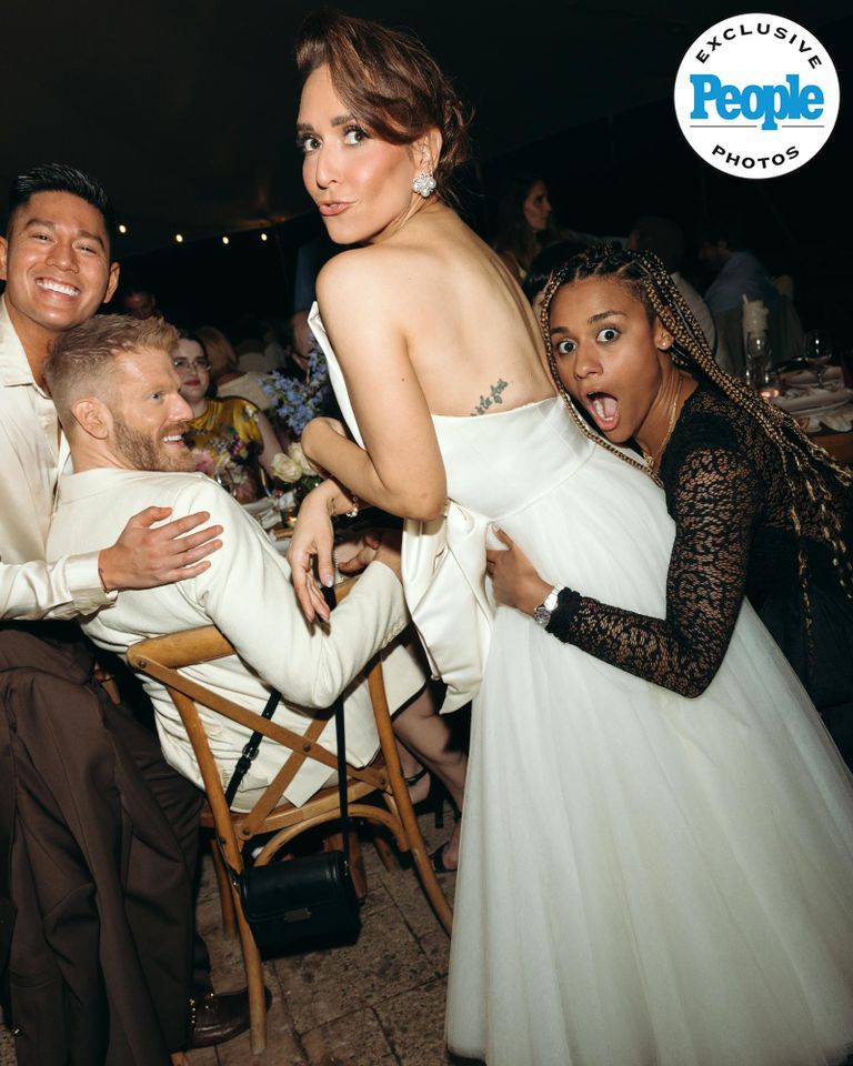 Jessica Vosk receives a hug from Ariana DeBose, alongside Mark and Scott HoynigCredit: Laurel Hinton