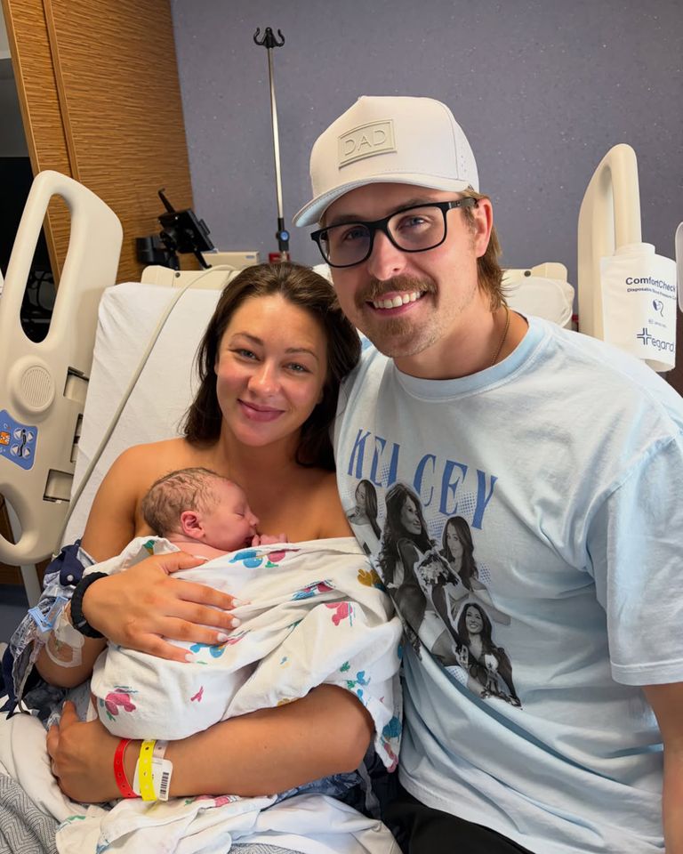 A woman holding a newborn baby next to a man wearing glasses and a cap in a hospital room Kelcey Wetterberg and Nate Crnkovich holding their newborn baby JackCredit: Kelcey Wetterberg/instagram