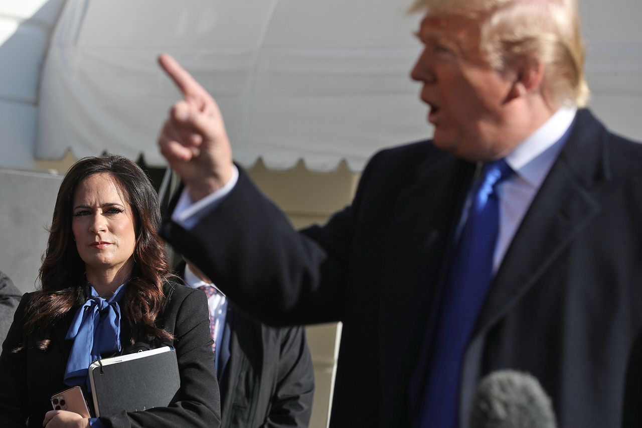 White House press secretary Stephanie Grisham listens to President Donald Trump talk to reporters at the White House on Nov. 8, 2019.Credit: Chip Somodevilla/Getty