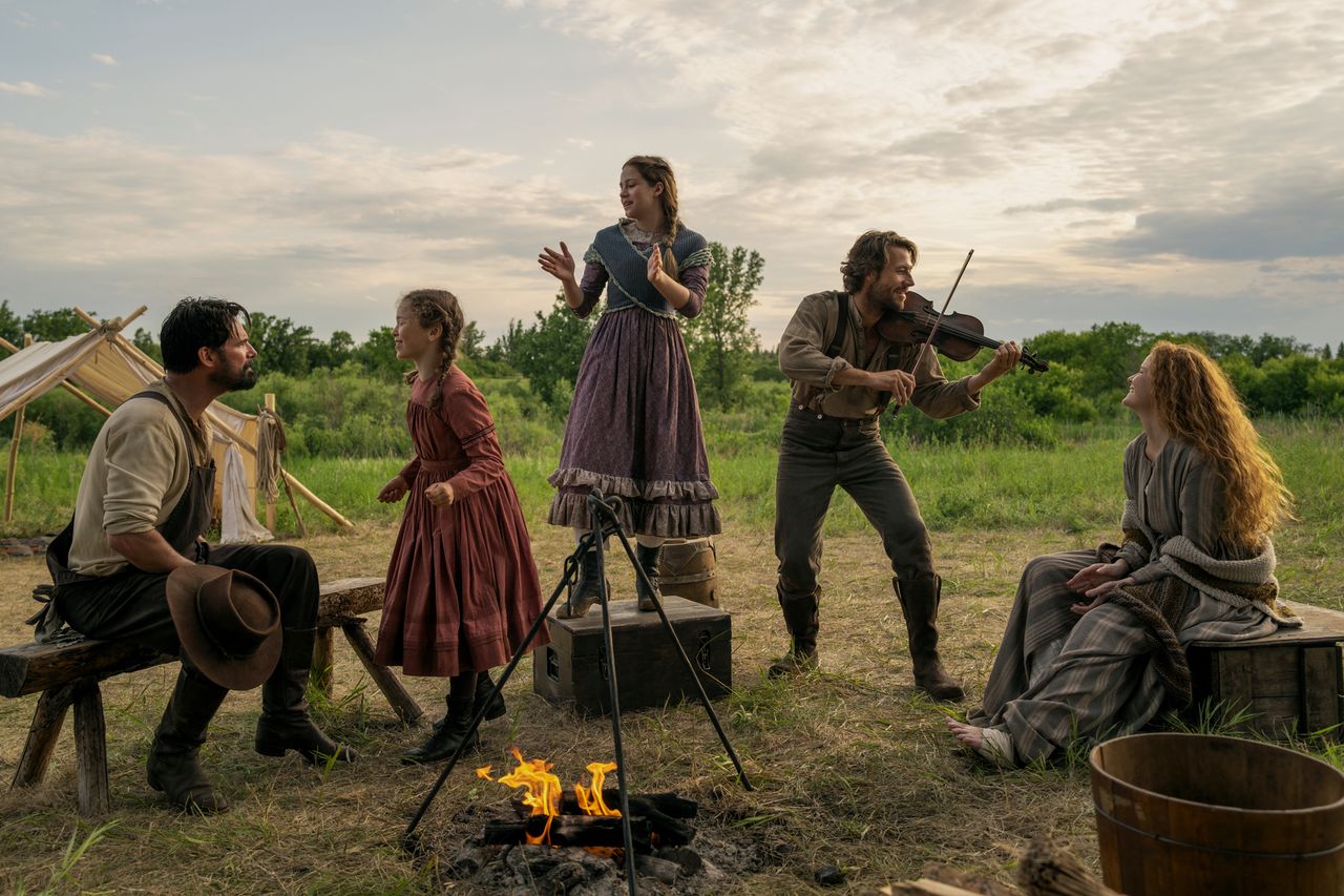 Little House on the Prairie - Warren Christie as John Edwards, Alice Halsey as Laura Ingalls, Skywalker Hughes as Mary Ingalls, Luke Bracey as Charles Ingalls, Crosby Fitzgerald as Caroline Ingalls Warren Christie as John Edwards, Alice Halsey as Laura Ingalls, Skywalker Hughes as Mary Ingalls, Luke Bracey as Charles Ingalls and Crosby Fitzgerald as Caroline Ingalls in ‘Little House on the Prairie’.Credit: Eric Zachanowich/Netflix