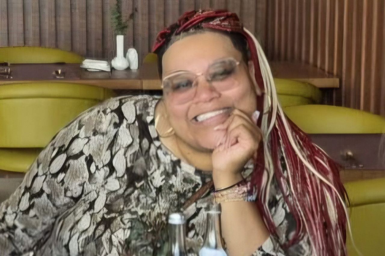 A smiling individual seated at a table with a relaxed demeanor Ayla GarciaCredit: GoFundMe