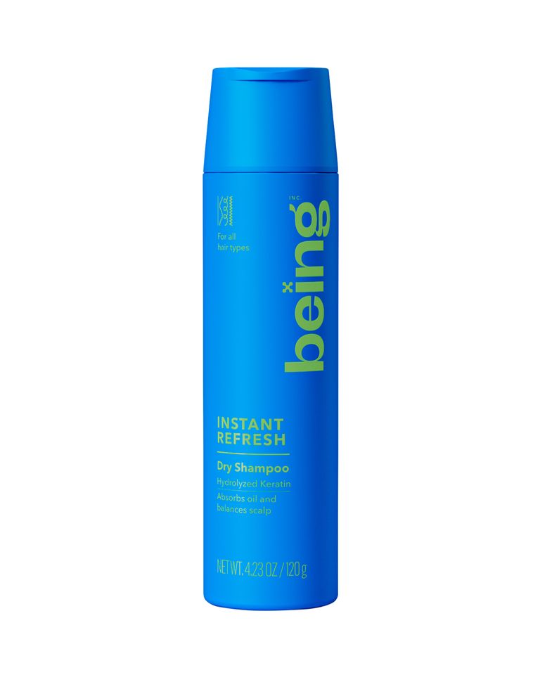 A blue bottle of Being Instant Refresh dry shampoo