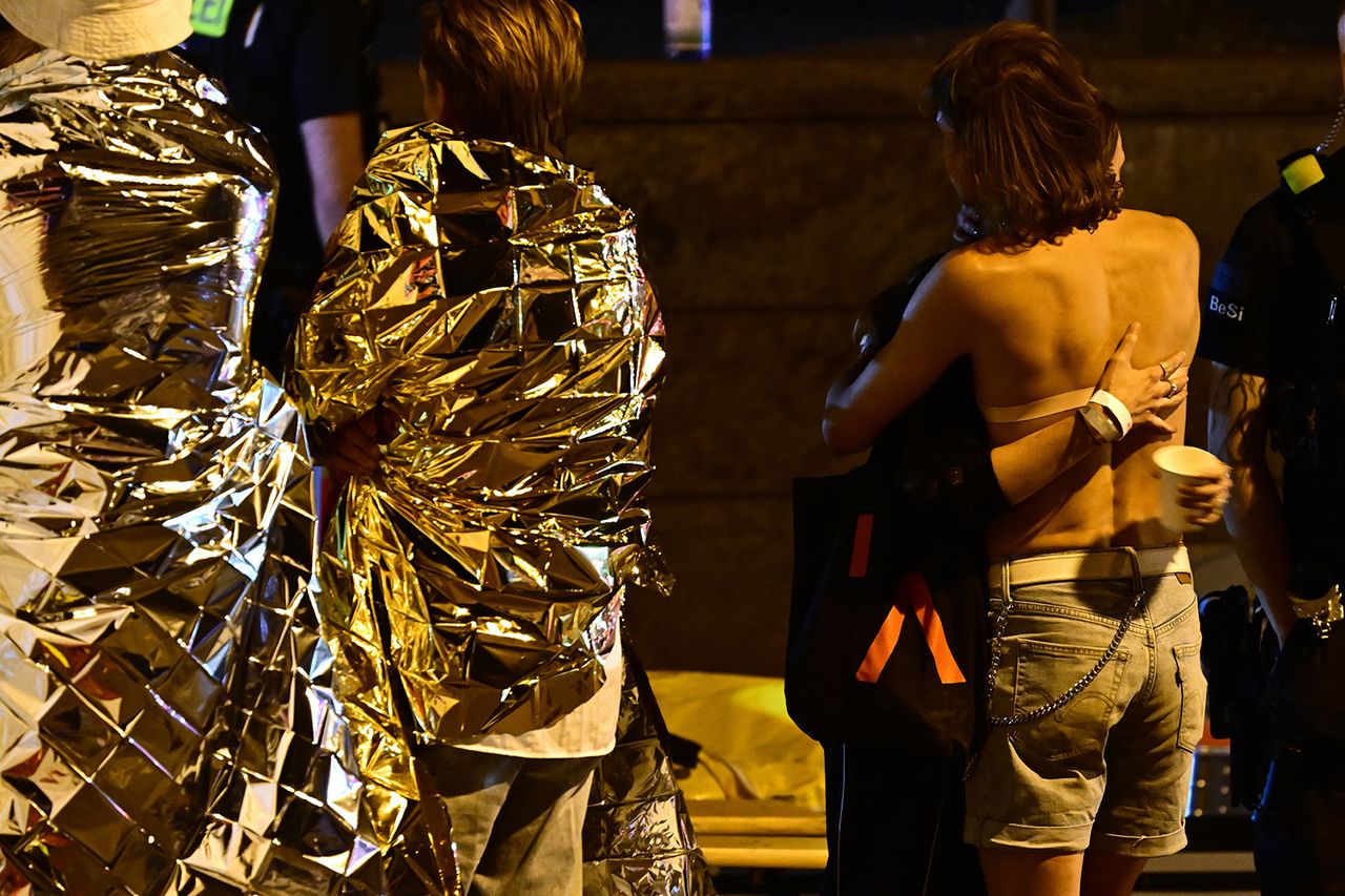 People wrapped in emergency blankets stand next to a fire department tent after the Christopher Street Day (CSD) event was called off. After a car struck and injured several people on the outskirts of the Christopher Street Day event in Berlin, police are searching for suspects. People wrapped in emergency blankets stand next to a fire department tent after the Christopher Street Day event was called off in Berlin on July 26, 2026Credit: Fabian Sommer/picture alliance via Getty
