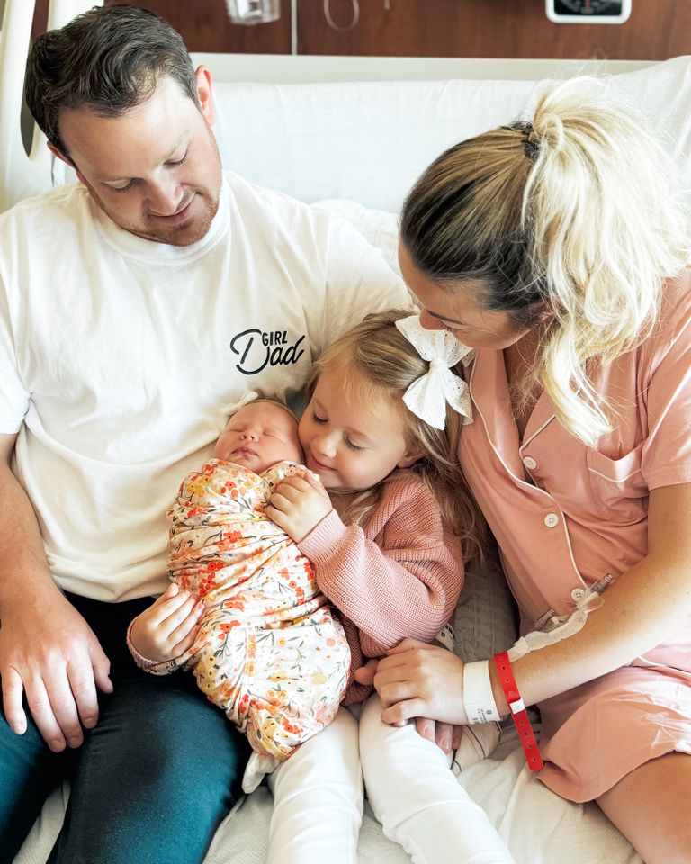 Breanna Lockwood with her family in the hospital Breanna Lockwood (right) with her husband Aaron and their daughters.Credit: Courtesy of Breanna Lockwood