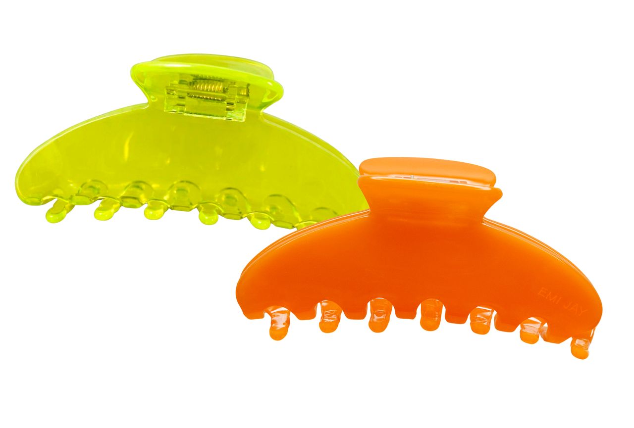 Two plastic hair claw clips one green and one orange with teeth for gripping hair