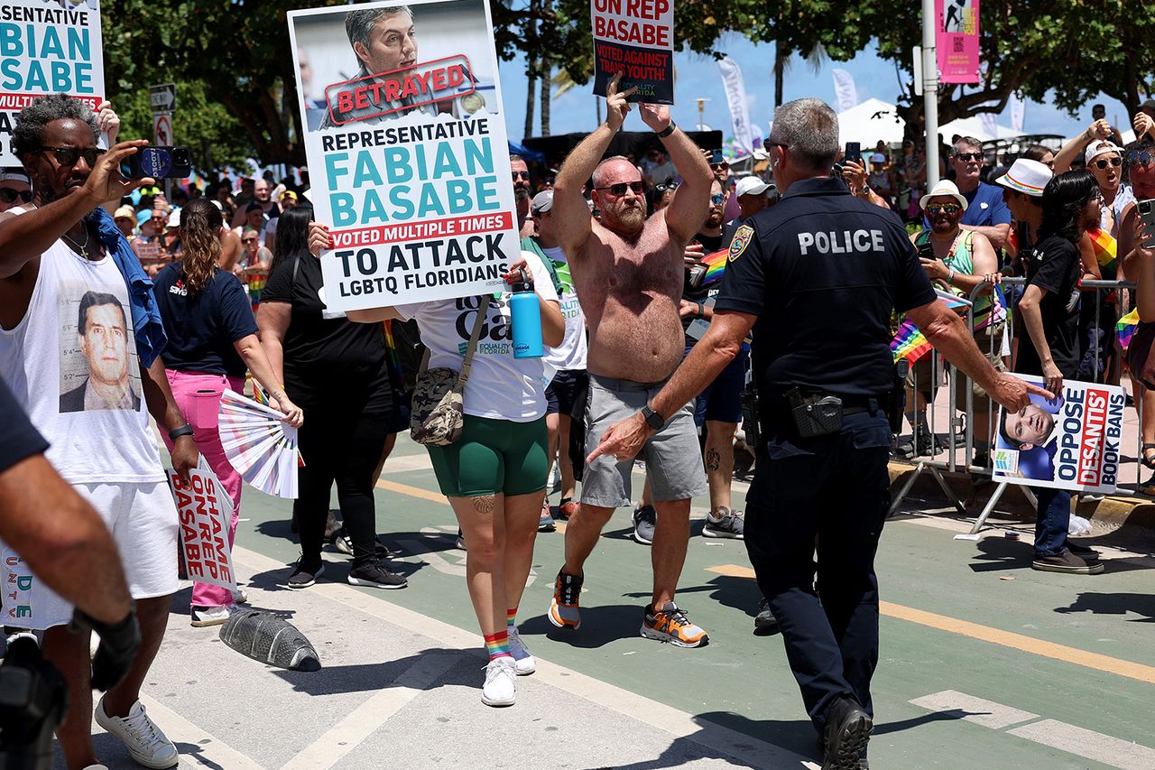 People block the road to express their anger toward Florida State House Rep. Fabián Basabe (R) as he rides in the 15th annual Miami Beach Pride Celebration parade on April 16, 2023 in Miami Beach, Florida. Basabe was met with the angry parade goers after they say he voted recently to advance legislation in the Florida House that advocates say will stigmatize and dehumanize the LGBTQ community. The parade featured a celebration of the LGBTQ+ community with floats, drag performers, and other parade participants. People block the road to express their anger toward Florida state Rep. Fabián Basabe as he rides in the 15th annual Miami Beach Pride Celebration parade on April 16, 2023.Credit: Joe Raedle/Getty