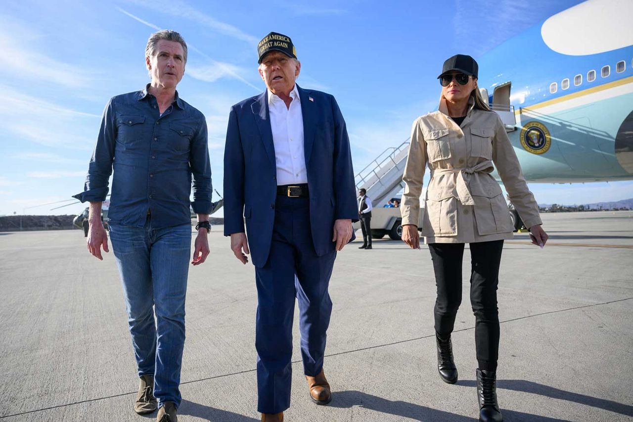 President Donald Trump flanked by first lady Melania Trump and California Gov. Gavin Newsom at the Los Angeles International Airport on Jan. 23.Credit: MANDEL NGAN/AFP via Getty