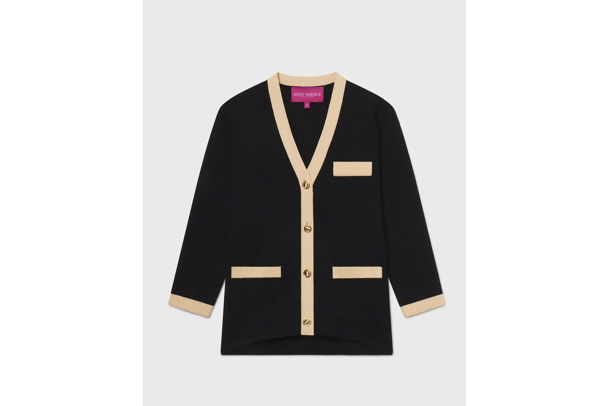 Heidi Merrick black and beige cardigan with gold buttons.