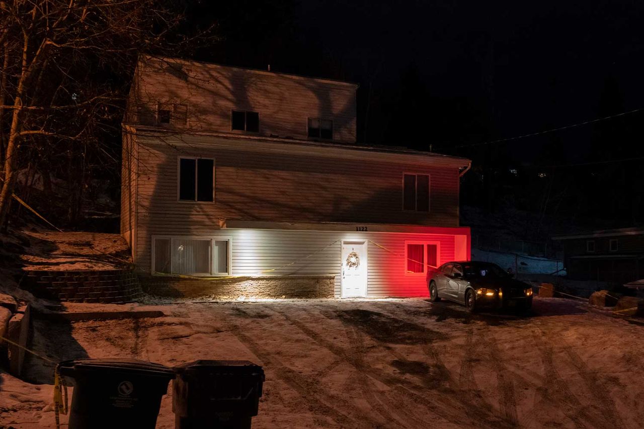 A private security officer sits in a vehicle, Tuesday, Jan. 3, 2023, in front of the house in Moscow, Idaho where four University of Idaho students were killed in November, 2022. Authorities said Wednesday, Jan. 4, that Bryan Kohberger, the man accused in the killings, has left a Pennsylvania jail in the custody of state police. Credit: Ted S. Warren/AP