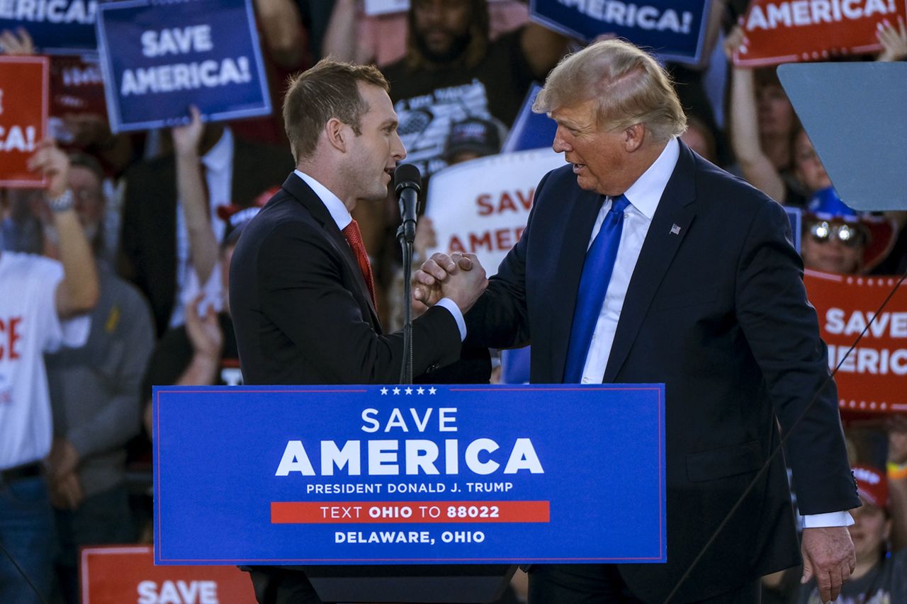 Then-candidate Max Miller embraces former President Donald Trump during a rally in Delaware, Ohio, on April 23, 2022.Credit: Eli Hiller/Bloomberg via Getty