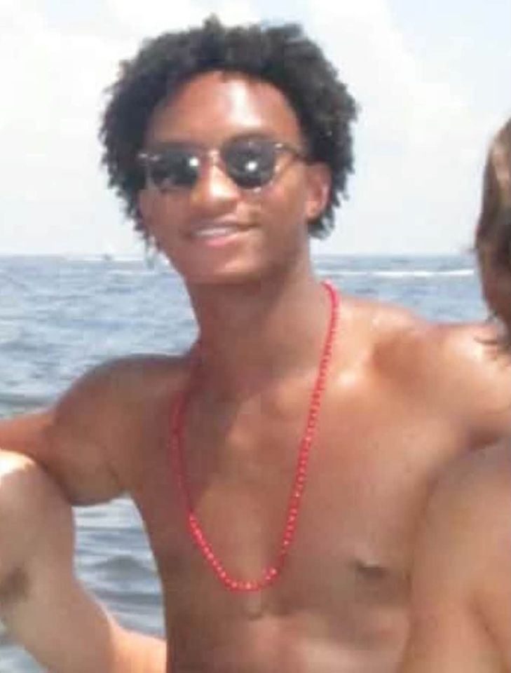 A person wearing sunglasses a red bead necklace and standing outdoors near a body of water Nolan Xavier Wells, Mississippi teen vanished during a July 4 trip to Horn IslandCredit: Jackson County Sheriff's Department