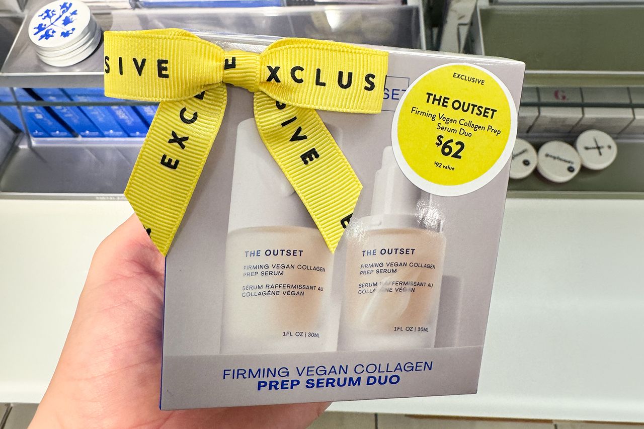 A box containing a serum product labeled The Outset with a prominent yellow ribbon marked EXCLUSIVE and a yellow price sticker Credit: People