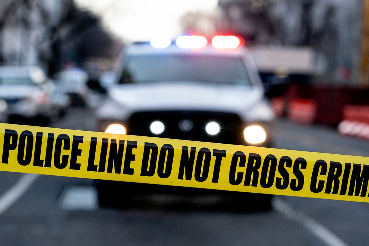 Stock photo of police tape in front of a police vehicle A stock photo of a police vehicle behind police tapeCredit: STEFANI REYNOLDS/AFP via Getty Stock Images