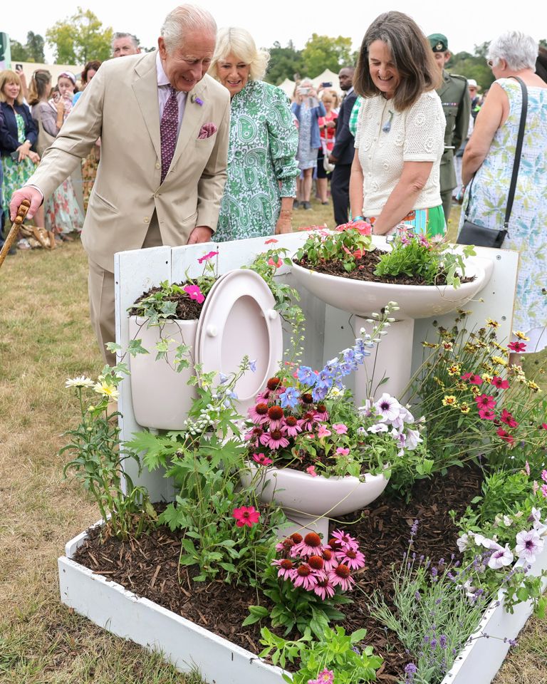 King Charles and Queen Camilla view an exhibit of flowers arrangement in discarded and upcycled materials at the RHS Sandringham Flower Show on July 22, 2026Credit: Chris Jackson/Getty