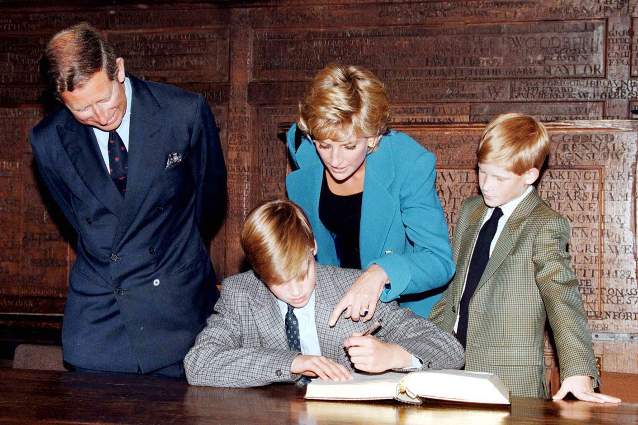 Prince William signs in on his first day at Eton College watched by his parents, he Prince and Princess of Wales and brother, Prince Harry on September 6, 1995 in Windsor, England. Prince Charles, Prince William, Princess Diana and Prince Harry at Eton College in September 1995Credit: Anwar Hussein/WireImage