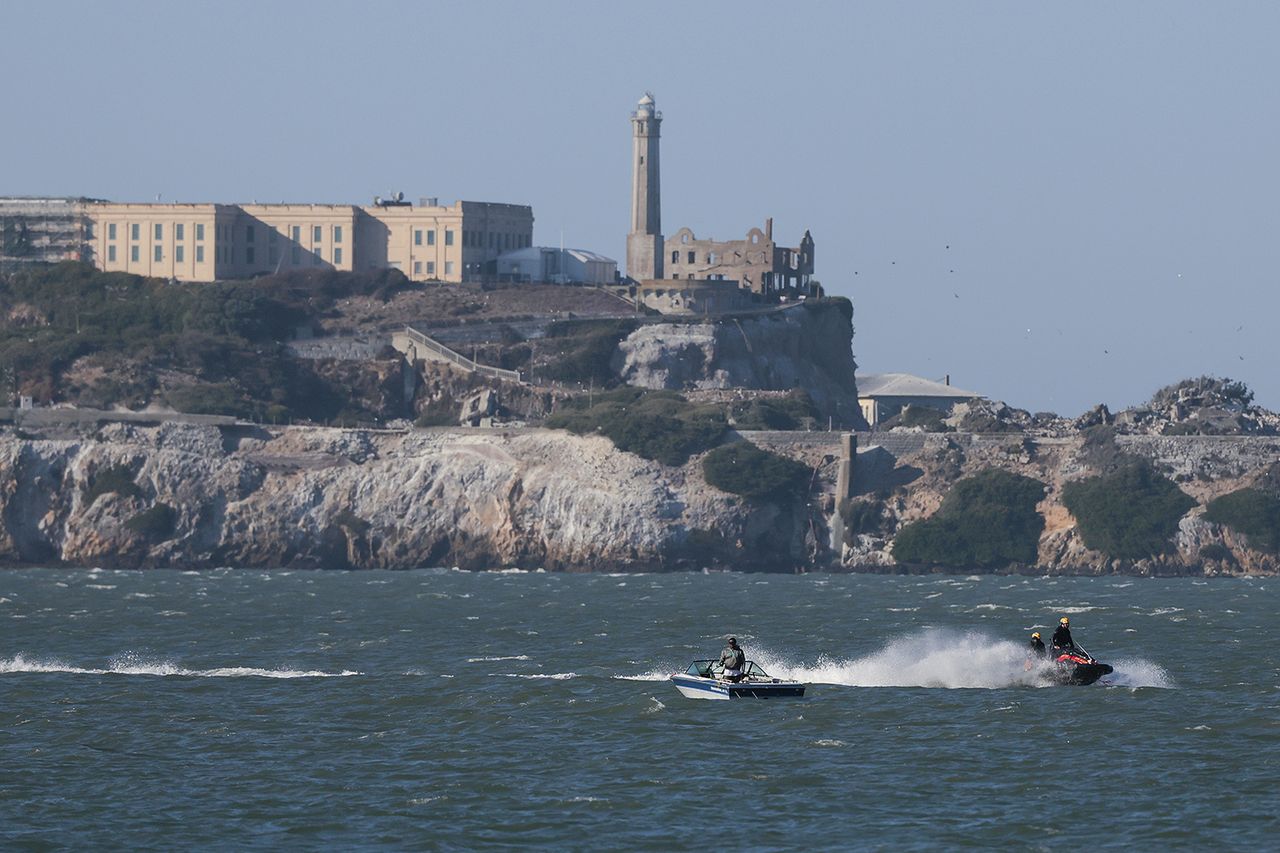 Jet skis patrol the water near Alcatraz looking for two missing individuals after a pontoon boat capsized on July 14, 2026 in San Francisco, California. Jet skis patrol the water near Alcatraz after the boat capsized on July 14, 2026Credit: Heather Diehl/Getty