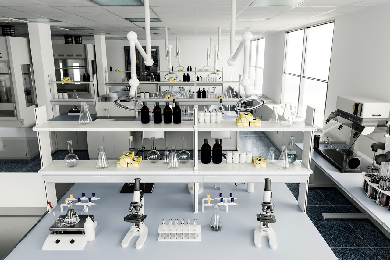 Empty interior of a contemporary science laboratory featuring microscopes, test tubes, flasks, and various instruments on white benches Stock image of a laboratoryCredit: Getty