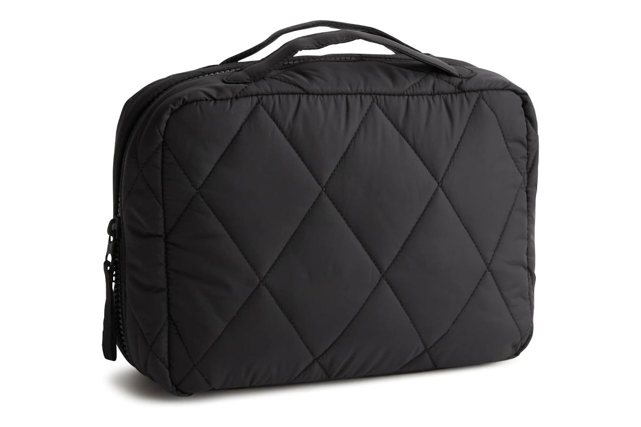 A quilted travel organizer with a handle Credit: Amazon
