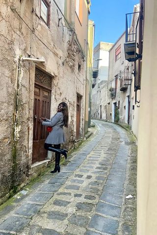 Celina Sengendo in front of her new home in SicilyCredit: Celina Sengendo