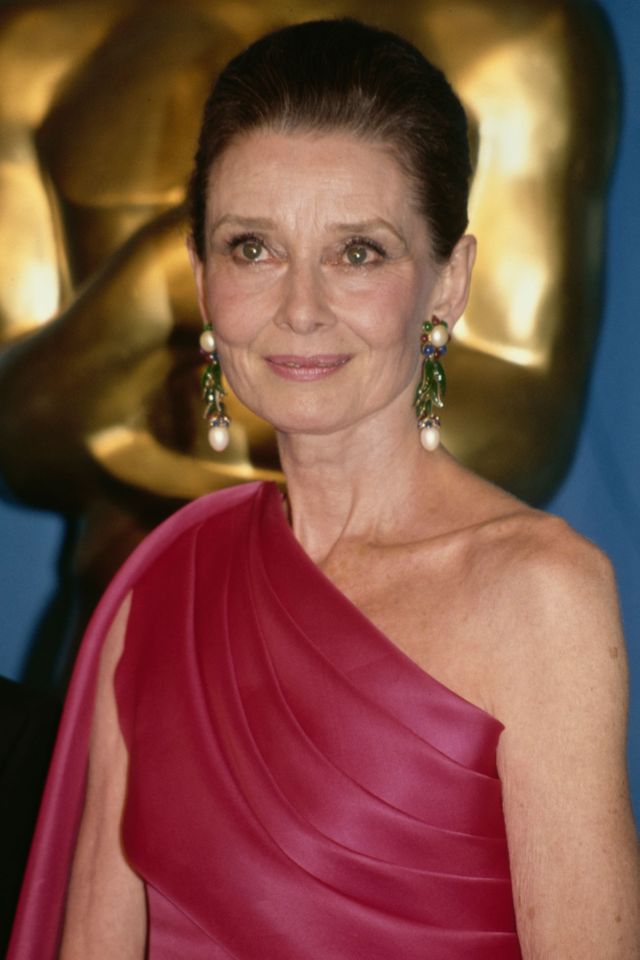 Audrey Hepburn (1929-1993), wearing an asymmetrical fuchsia pink evening gown, in the press room of the 64th Academy Awards, held at the Dorothy Chandler Pavilion in Los Angeles, California, 30th March 1992 Audrey Hepburn in 1992Credit: Vinnie Zuffante/Getty