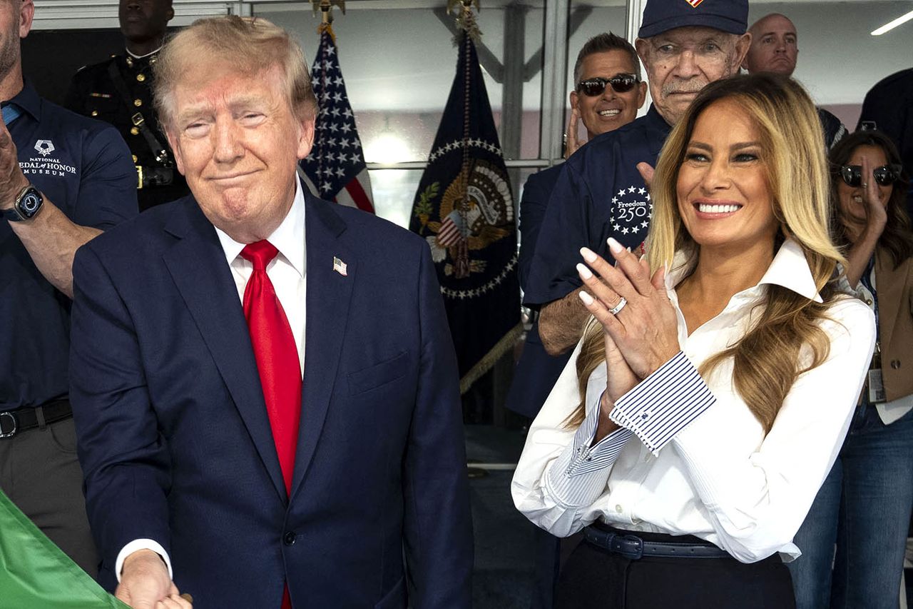 US President Donald Trump waves the green flag to start the race with First Lady Melania Trump at his side, during the Freedom 250 Grand Prix Race on the streets of Washington, DC, on August 23, 2026. Donald and Melania Trump at the Freedom 250 Grand Prix Race in Washington, D.C., on Aug. 23, 2026Credit: Doug MILLS / POOL / AFP via Getty