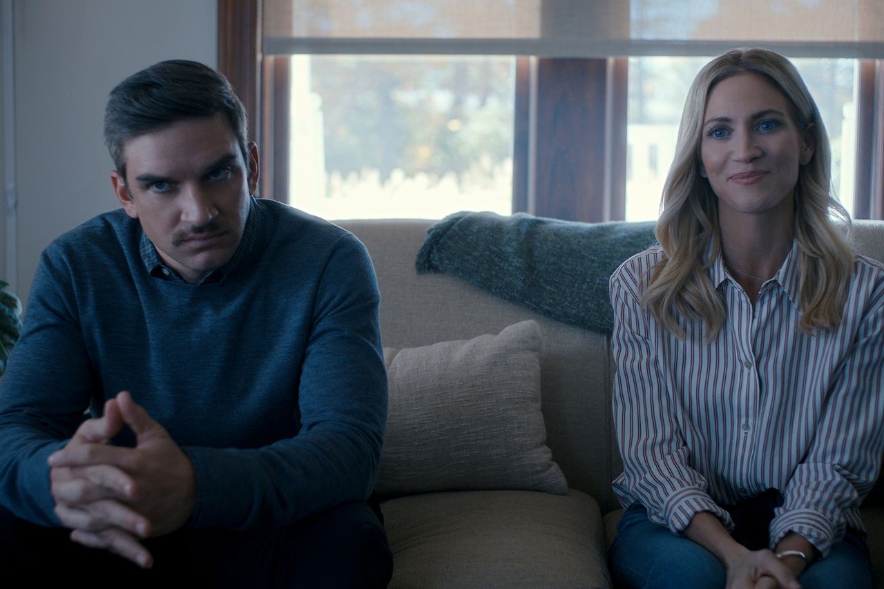 Evan Jonigkeit and Brittany Snow seated on a couch Evan Jonigkeit and Brittany Snow in ‘The Hunting Wives’ season 2Credit: Netflix