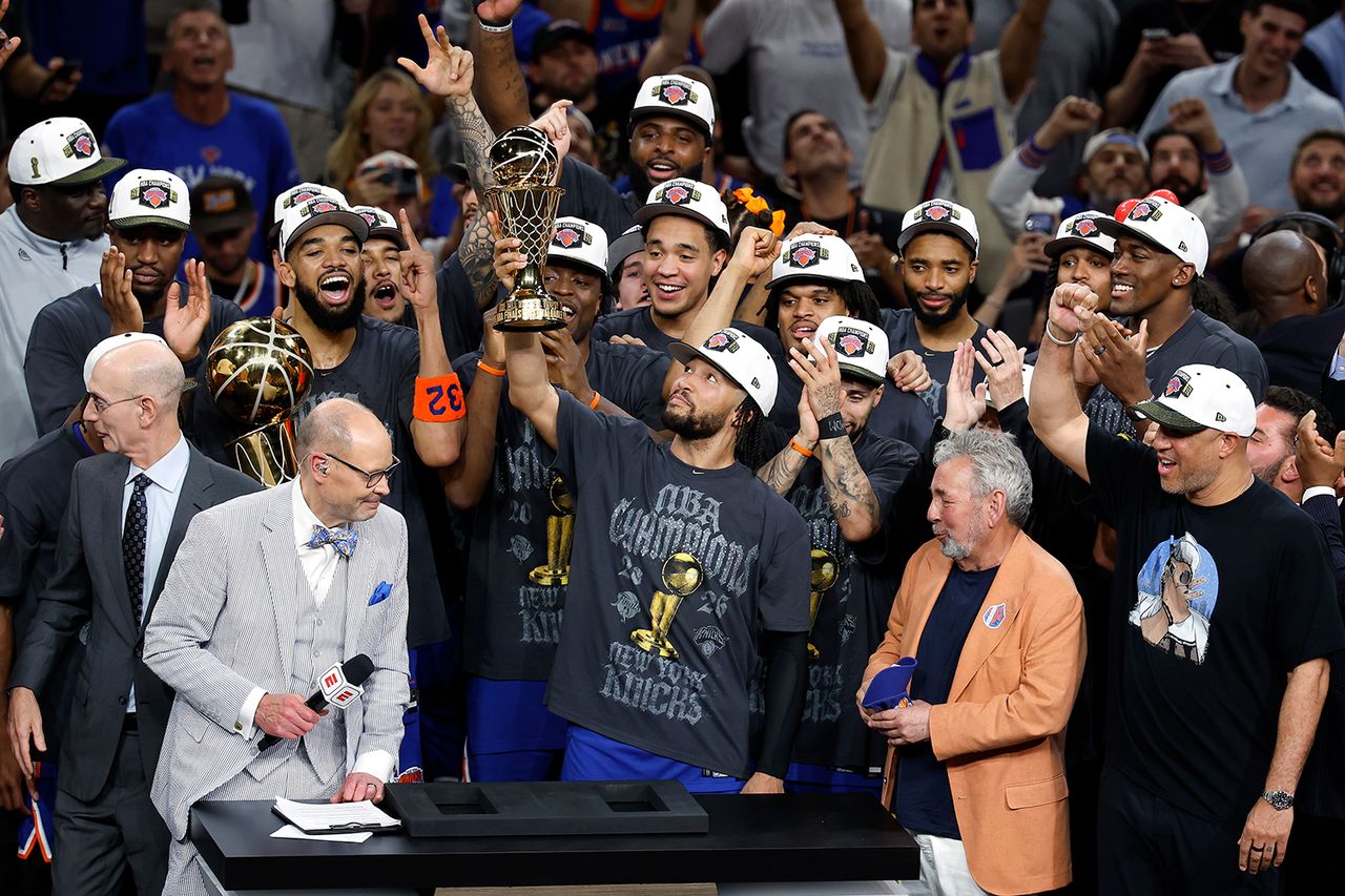 The New York Knicks hold up the NBA Championship trophy on June 13, 2026Credit: Ronald Cortes/Getty