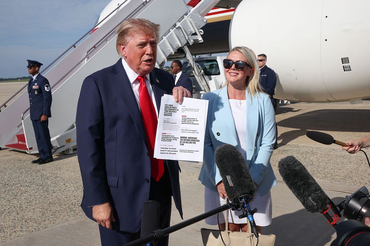 U.S. President Donald Trump shows copies of recent headlines as he speaks with reporters with Press Secretary Karoline Leavitt looking on before boarding Air Force One on August 21, 2026 President Donald Trump shows copies of recent headlines as he speaks with reporters, with Press Secretary Karoline Leavitt looking on before boarding Air Force One on August 21, 2026Credit: Win McNamee/Getty