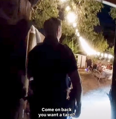 Wedding guests ask officers if they want a taco in body cam footage.Credit: Moore Police Department