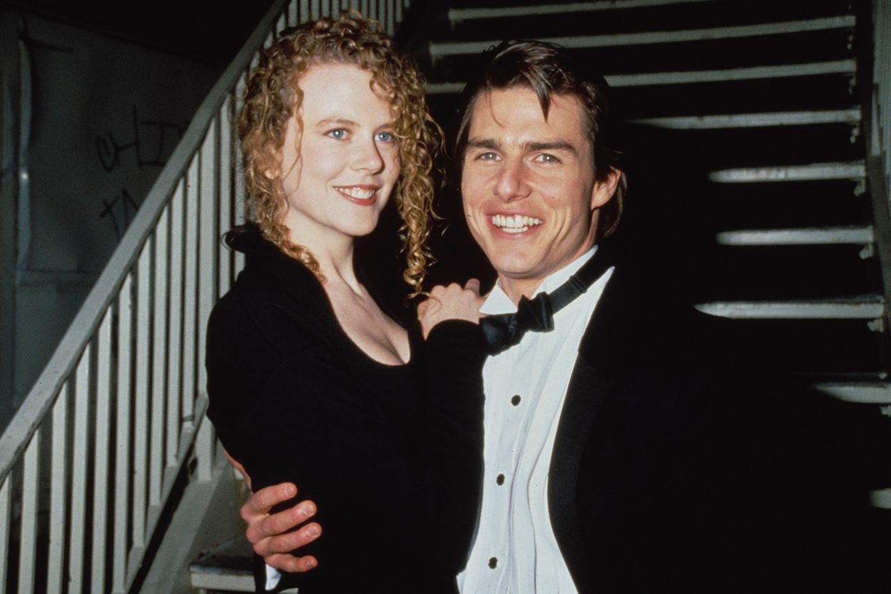 Tom Cruise and Nicole Kidman posing together standing on a staircase dressed formally Nicole Kidman and Tom Cruise are pictured in March 1991Credit: Vinnie Zuffante/Getty