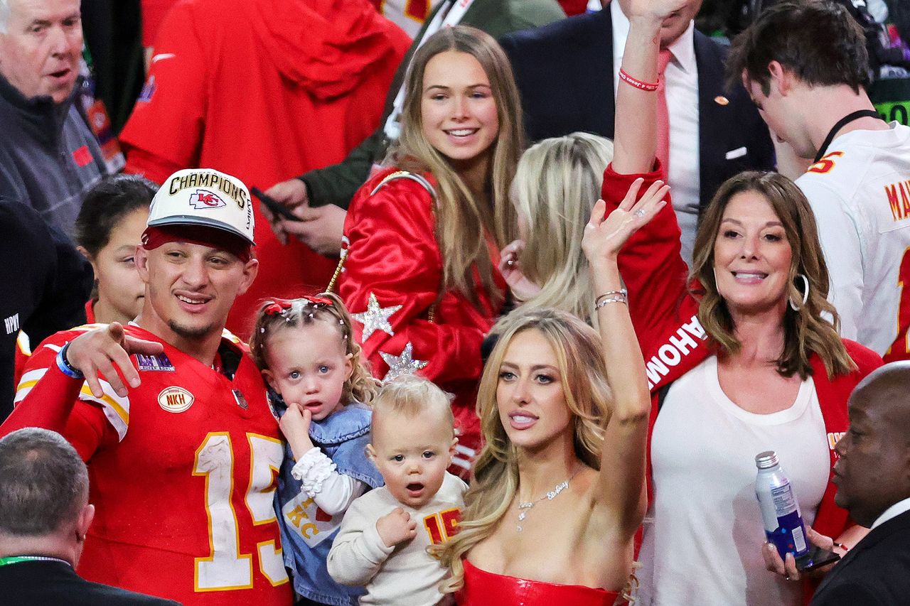 Jackson Mahomes, quarterback Patrick Mahomes #15 of the Kansas City Chiefs, Sterling Skye Mahomes, Patrick Patrick and Brittany Mahomes celebrate with their kids after the Kansas City Chiefs defeated the San Francisco 49ers in Super Bowl LVIII.Credit: Ethan Miller/Getty