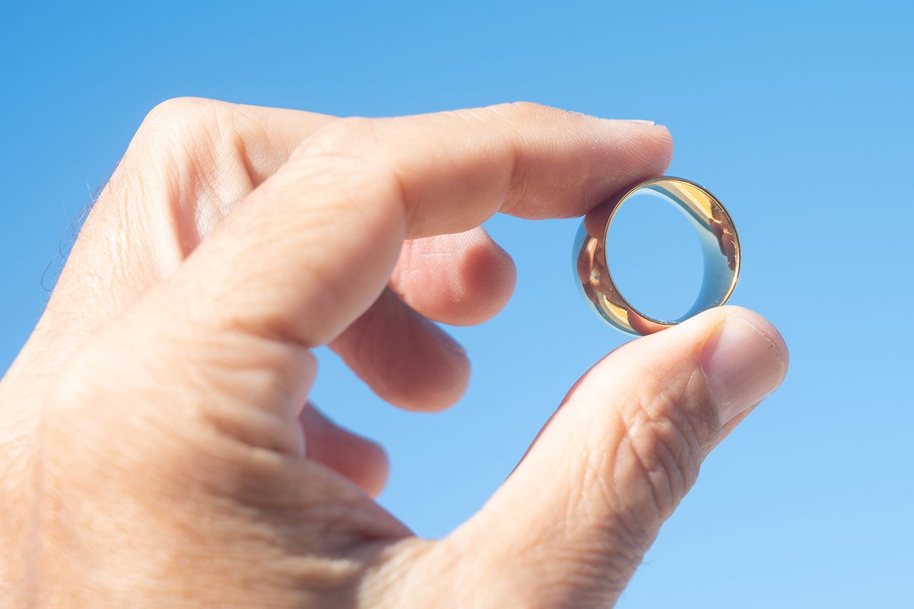 Ring-hand-stock Man holding wedding ring (stock image)Credit: Getty