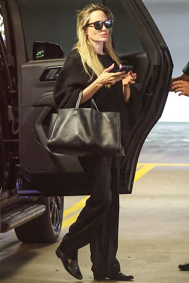 Angelina Jolie was spotted running errands in Beverly Hills wearing a black sweater, black pants, black flats, and a large black purse Credit: BACKGRID