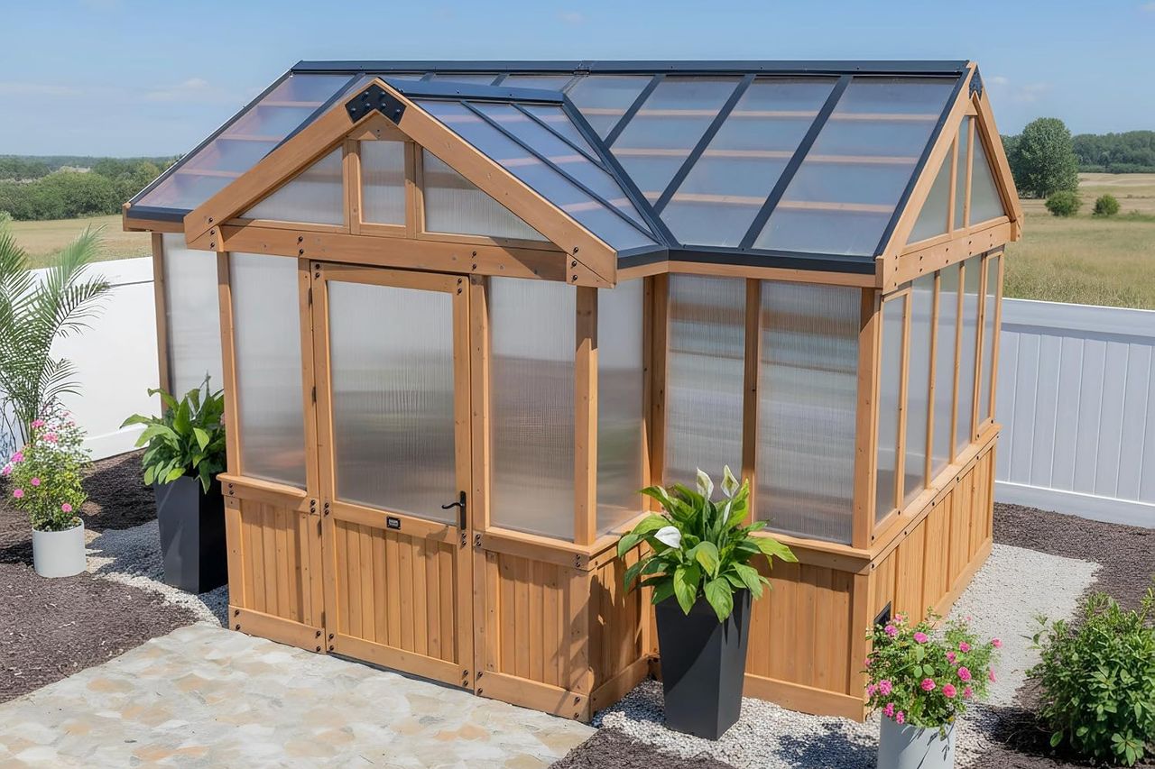 Backyard Discovery Savannah Chalet-Style 14.5' x 12' Cedar and Polycarbonate Walk-In Greenhouse Kit Credit: Amazon
