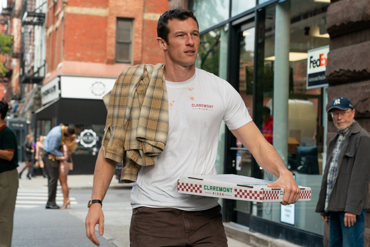 Callum Turner carrying a pizza box on a street Callum Turner as Owen in ‘One Night Only’Credit: Universal