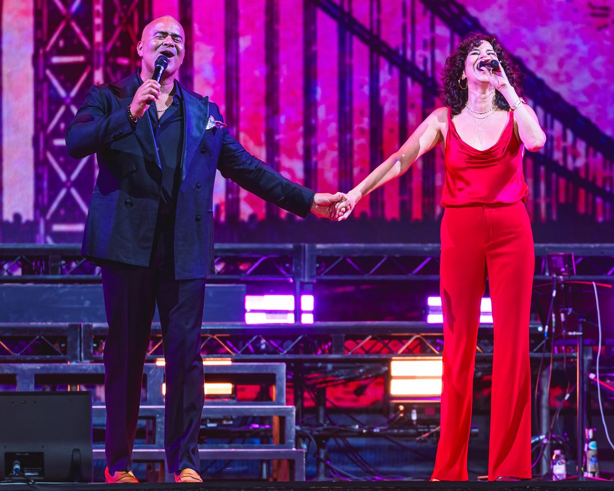 Christopher Jackson performing on stage standing with Mandy Gonzalez both holding hands and singing into microphones Christopher Jackson and Mandy Gonzalez reunite at The Festival on Friday, Aug. 14 at Hutton Brickyards Riverfront Hotel + Venue in Kingston, N.Y.