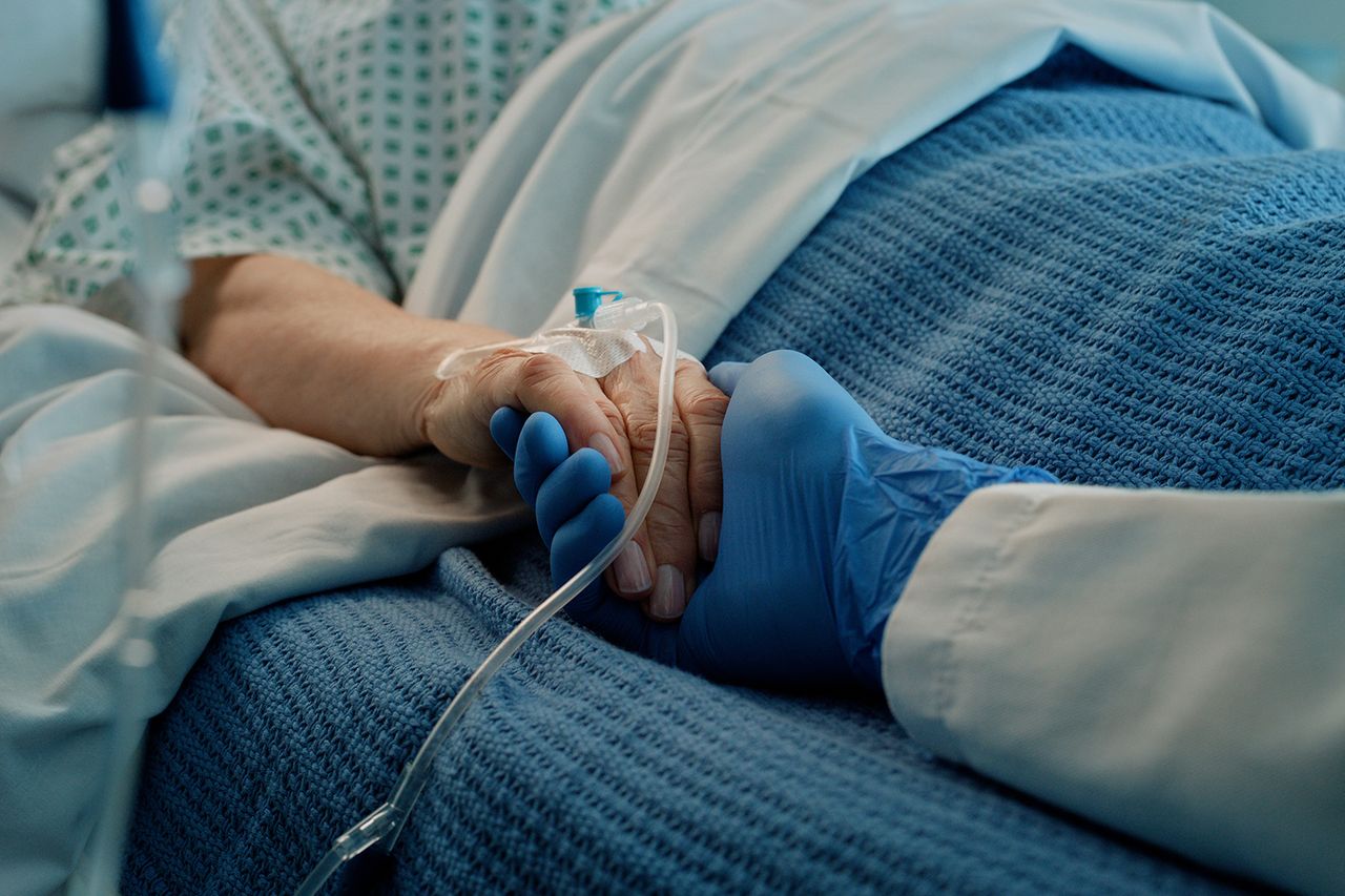 A medical professional holding a patient’s hand (stock image)Credit: Getty