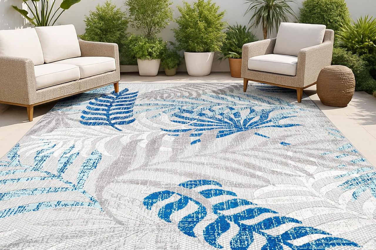 Amazon JONATHAN Y Tropics Palm Leaves Indoor Outdoor Area Rug Credit: Amazon